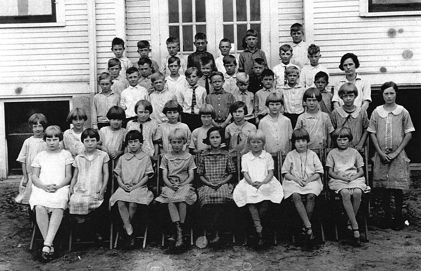 arthur maring op school 1925 in 1925.
Back Row: Bernard Vugteveen, John Bosgraaf (b.1917), Herbert Schut, Earl Elenbaas (b.1916), Gerrit Geers, Albert Dykema, Tony Woodwyk (b.1915)
Fourth Row: John Schuitema (b.1915), Gerrit Hoezee (b.1918), Bill Kuiper, Harold VerHage, Henry Christians, Herman Karsten (b.1918), James Lynema, Arthur Maring (b.1917)
Third Row: Joe Molter, Jake Woodwyke, Harold Roelofs, Arnold VanderVeen (b.1919), Boyd VanderLaan, Howard Hamburg (b.1918), Louis VanderMolen, Simon Kaminga, Carl Cooper (b.1918), Miss _________
Second Row: Gertrude (Klomp) DeVries, Jennie (Schut) Lubbers, Janet (Schut) Westrate, Johanna (Koopman) _____, Dena (Moes) Coeling, Gertrude (Roelofs) Schutte, Katharine (Bolhuis) Waite (b.1917), Marion Karsten?, Lavina (Hamming) Boldt, Cornelia (Holthof) VerHage, Jeanette (Dyke) VandeGuchte
First Row: Pearl (Koopman) _____, Geneva (Elenbaas) _____, Krina? (Timmer) _____, Rena (Woodwyke) _____, Ann (Dyke) Veldhouse, Gertrude (Schut) Kremers, Elsie (Kuiper) _____, Edith (Talsma) _____.